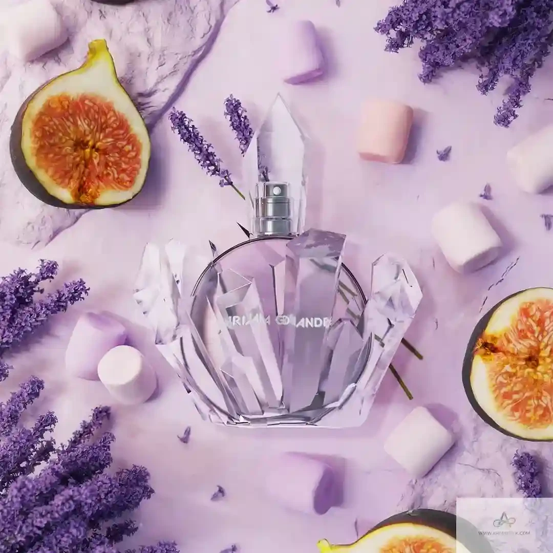 Perfume bottle with lavender, figs, and marshmallows on a purple background