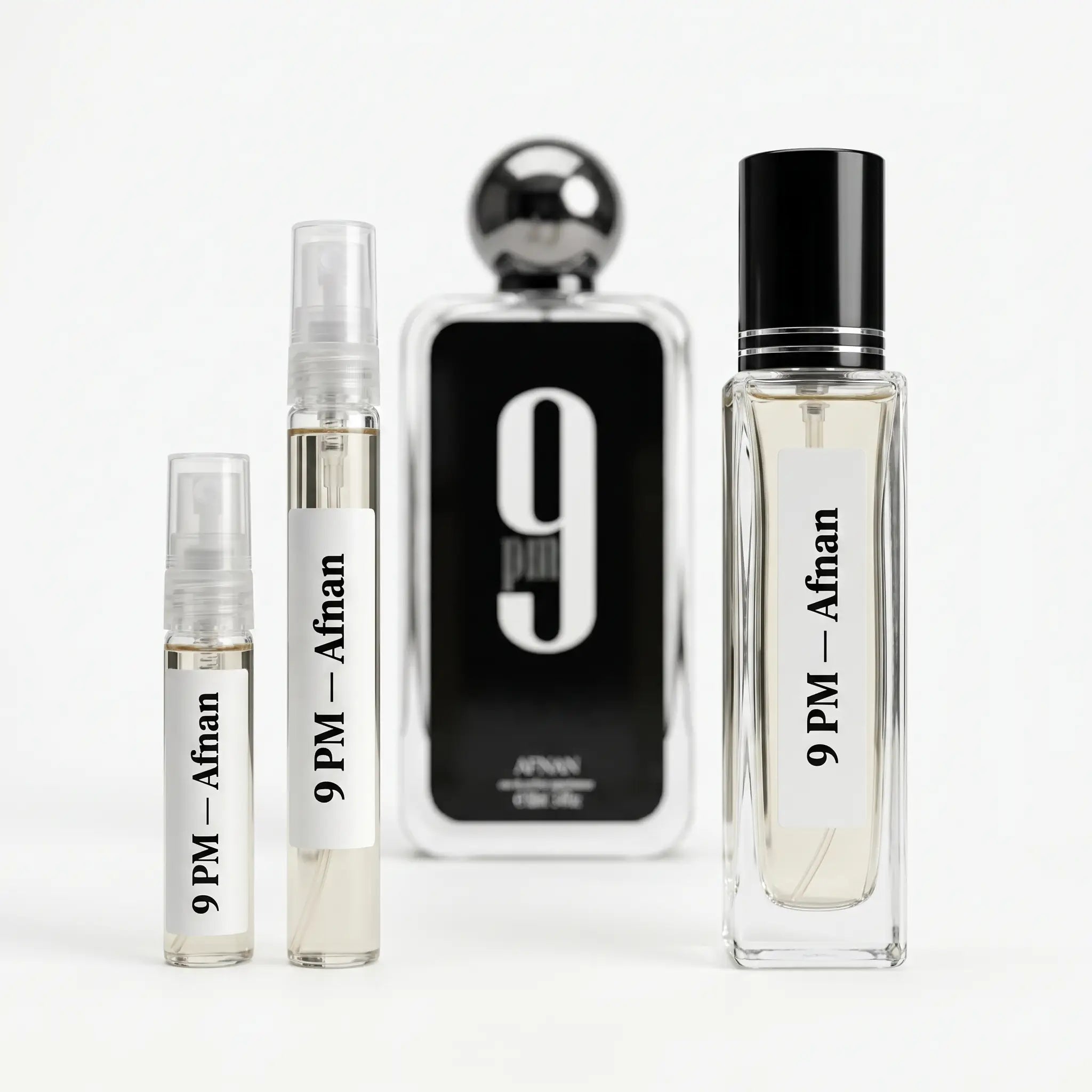 Afnan 9PM decants next to full black bottle with chrome ball cap on white background