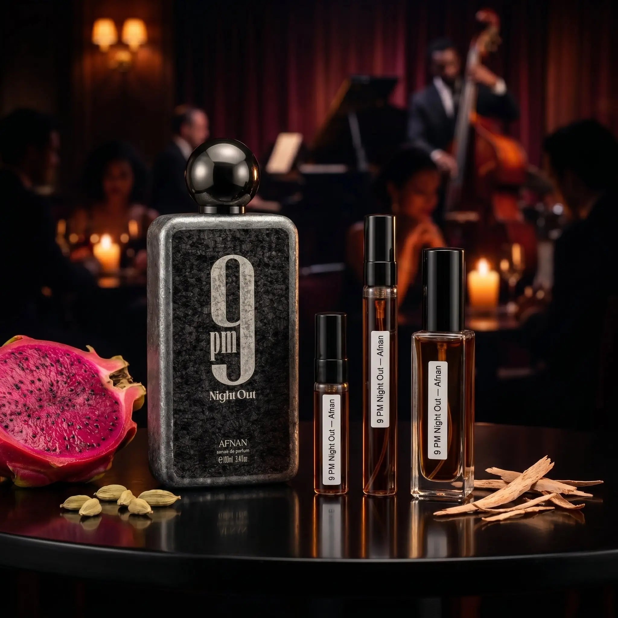 Afnan 9PM Night Out bottle and decants with dragon fruit and cardamom on table in candlelit jazz lounge
