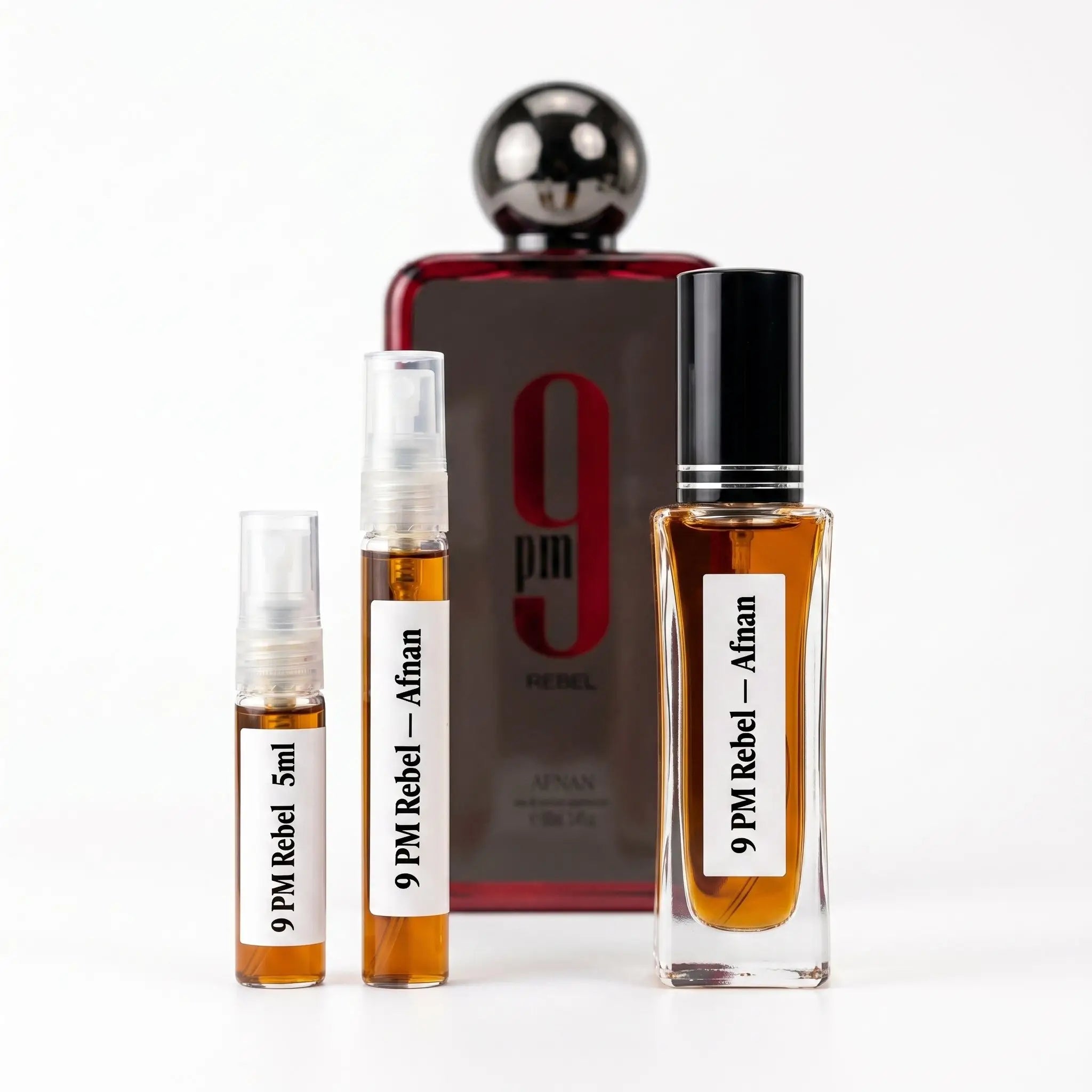 Afnan 9PM Rebel decants next to full red and grey bottle with chrome ball cap on white background
