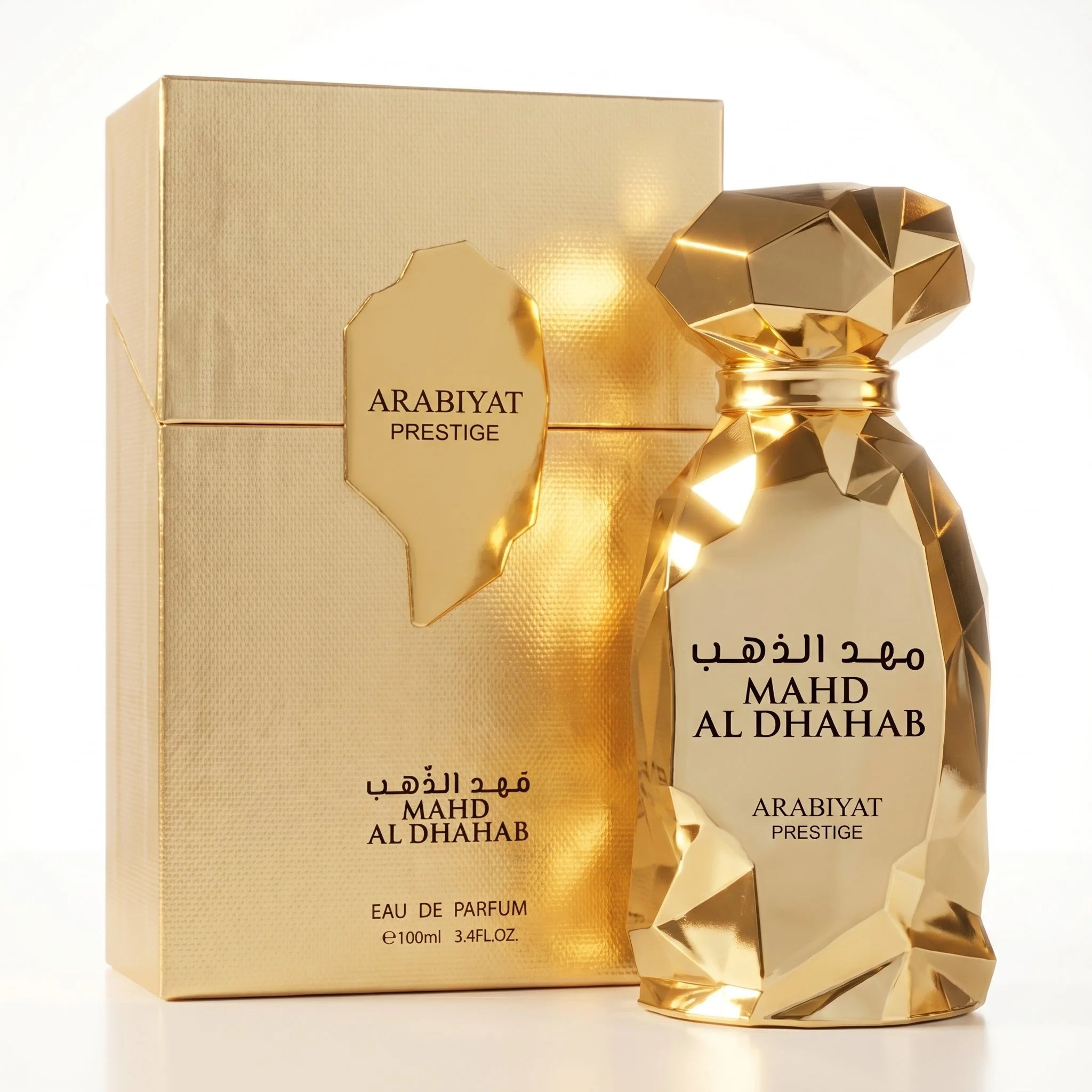 Arabiyat Prestige Mahd Al Dhahab EDP 100ml bottle and gold textured box on white background
