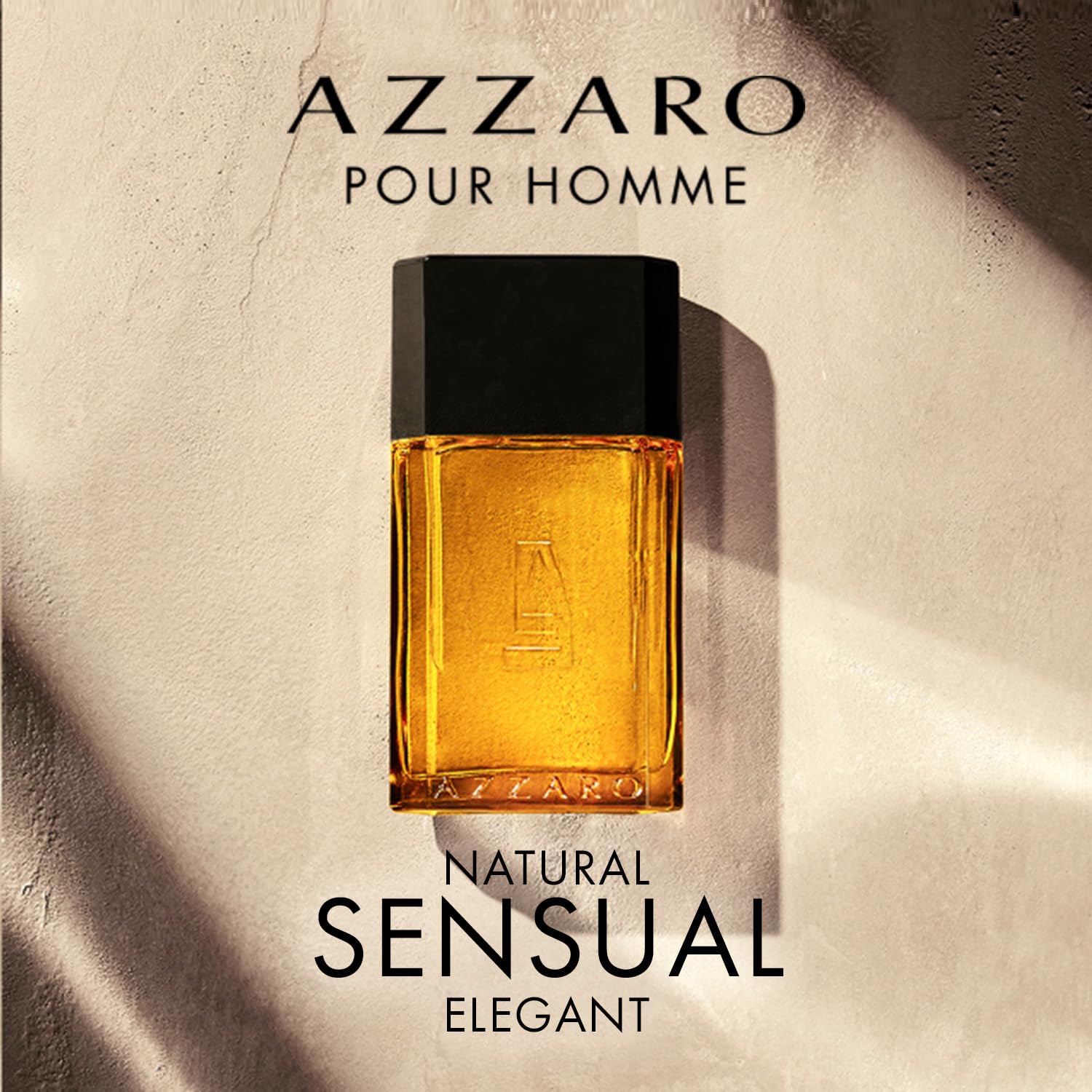 Azzaro Pour Homme perfume bottle on a textured beige background