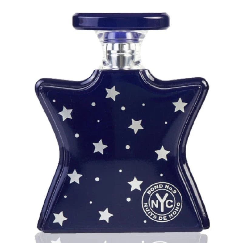 Navy blue perfume bottle with star patterns and 'Bond No. 9' logo on a white background