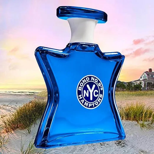 Blue Bond No. 9 NYC Hamptons perfume bottle with a beach background