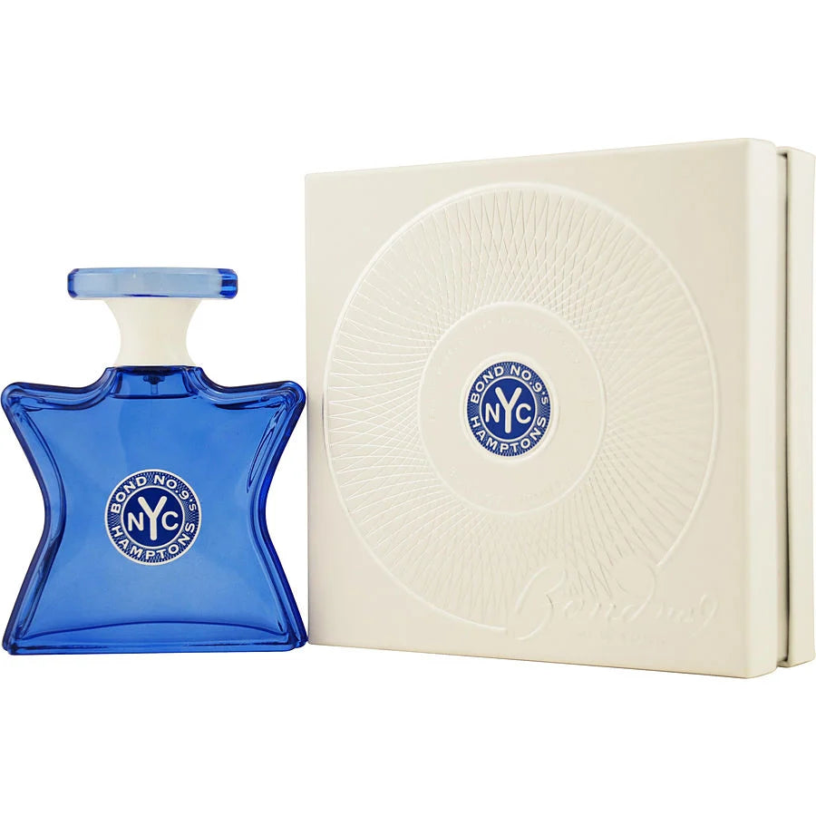 Blue perfume bottle and white box with 'Bond No. 9' logo on a white background