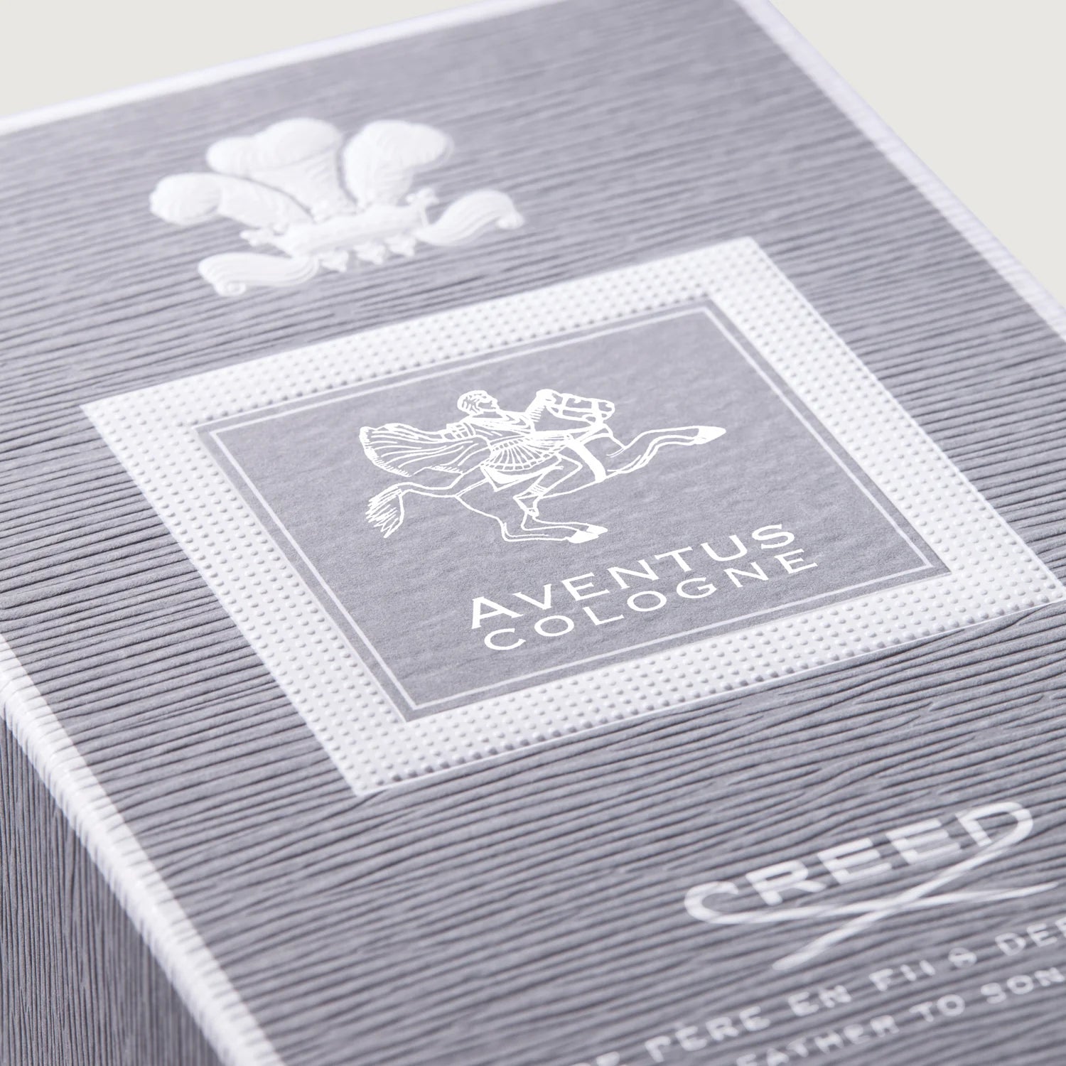 Close-up of a Creed Aventus Cologne packaging with branding details.