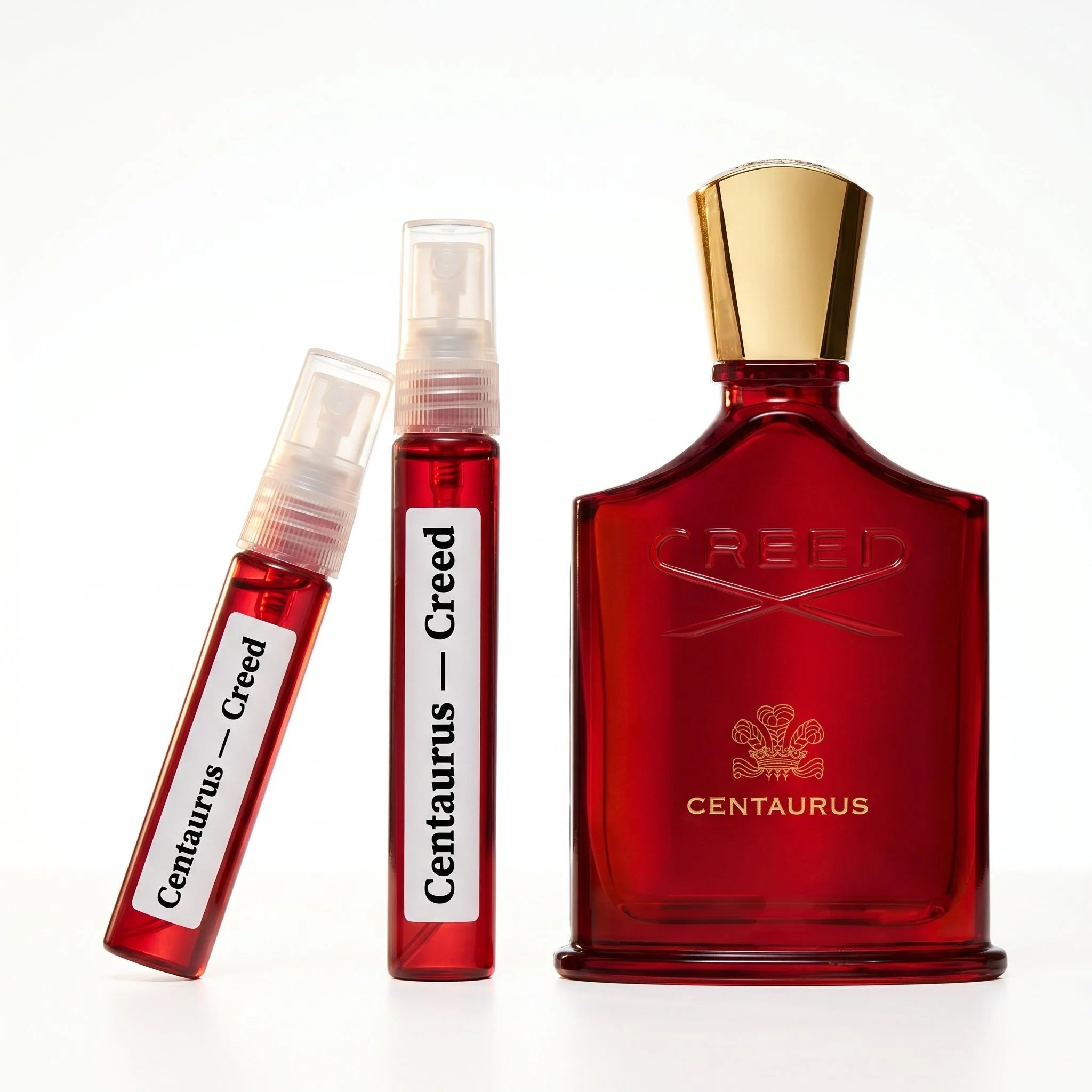 Creed Centaurus decant vials with crimson red bottle on white background luxury niche fragrance photography