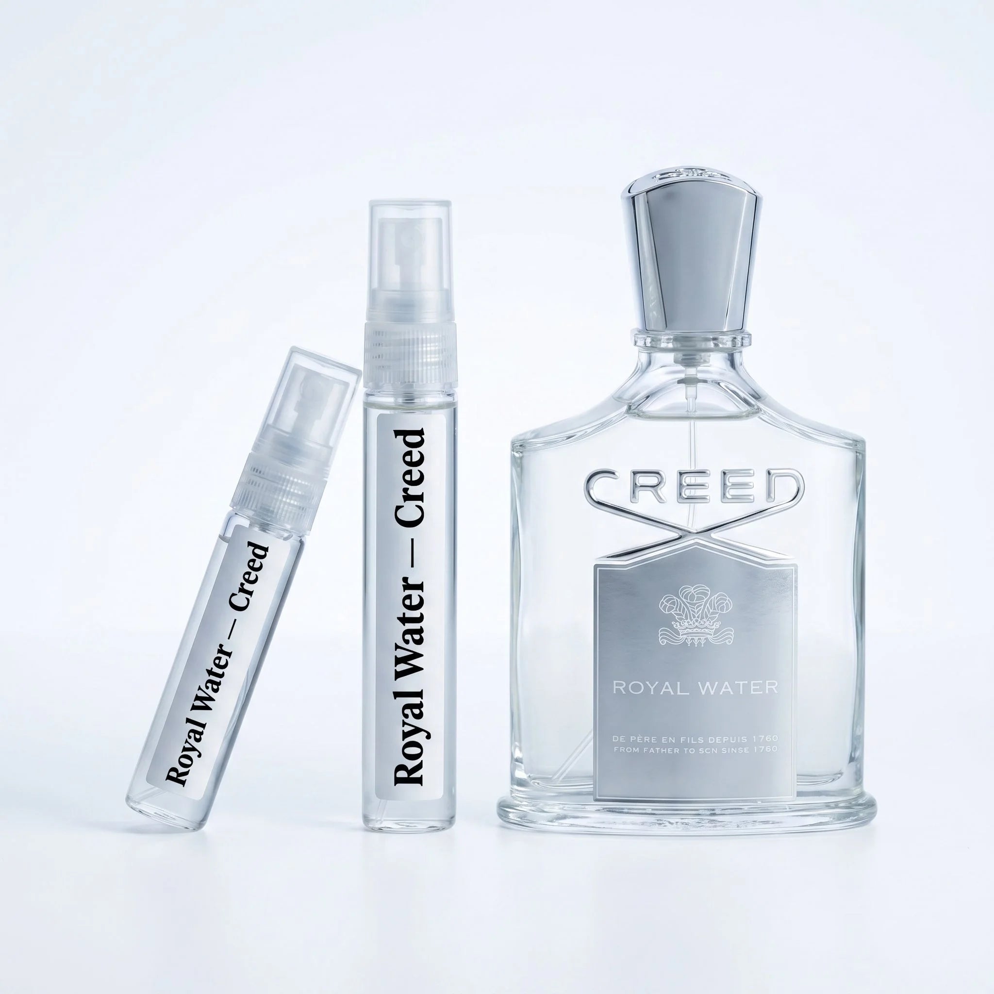 Creed Royal Water decant vials with clear glass bottle on white background luxury niche fragrance photography