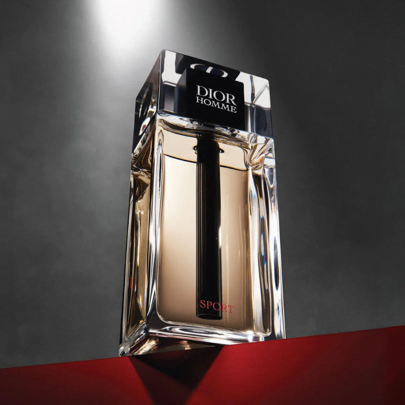 Dior Homme perfume bottle on a dark background
