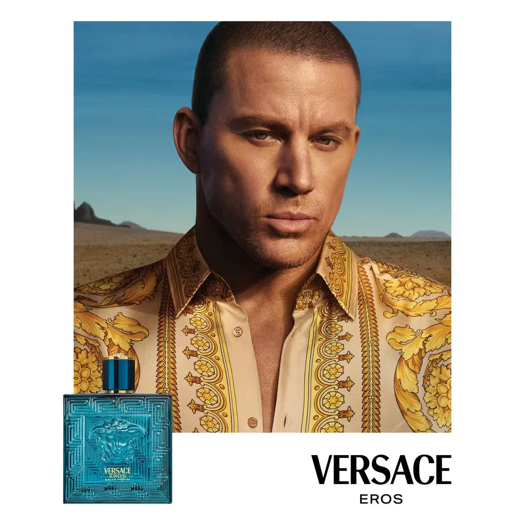 Versace Eros perfume bottle with a man in an ornate shirt against a desert background