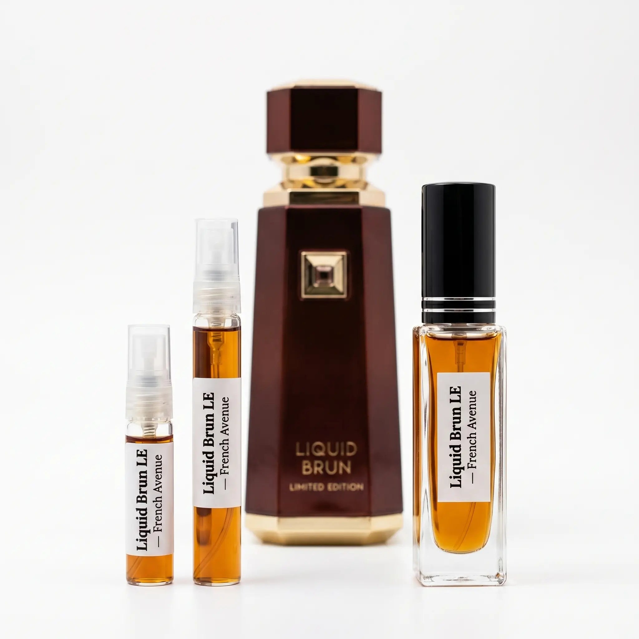 French Avenue Liquid Brun Limited Edition decants next to full burgundy and gold bottle on white background