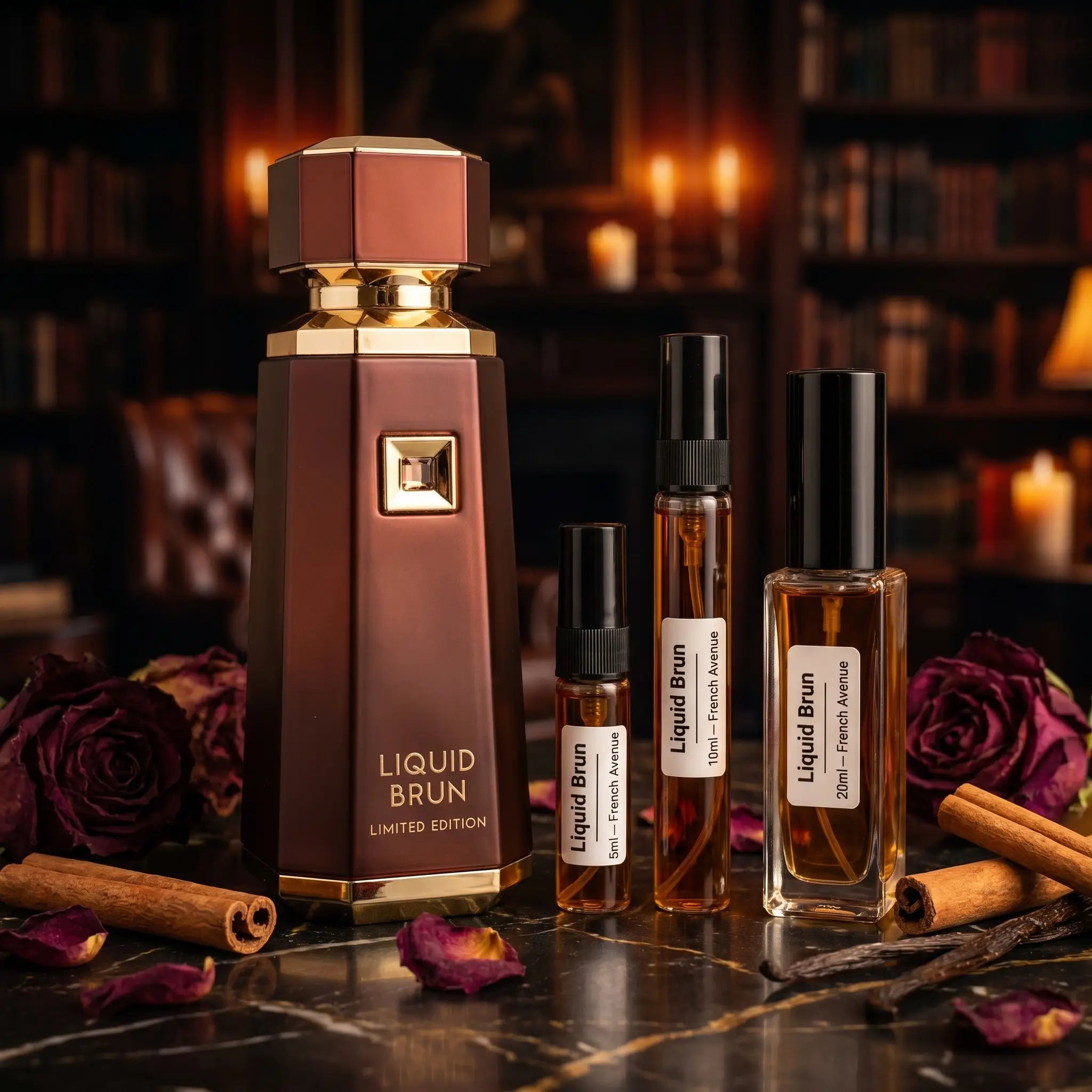 French Avenue Liquid Brun Limited Edition bottle with decants and dried roses on dark marble in candlelit library
