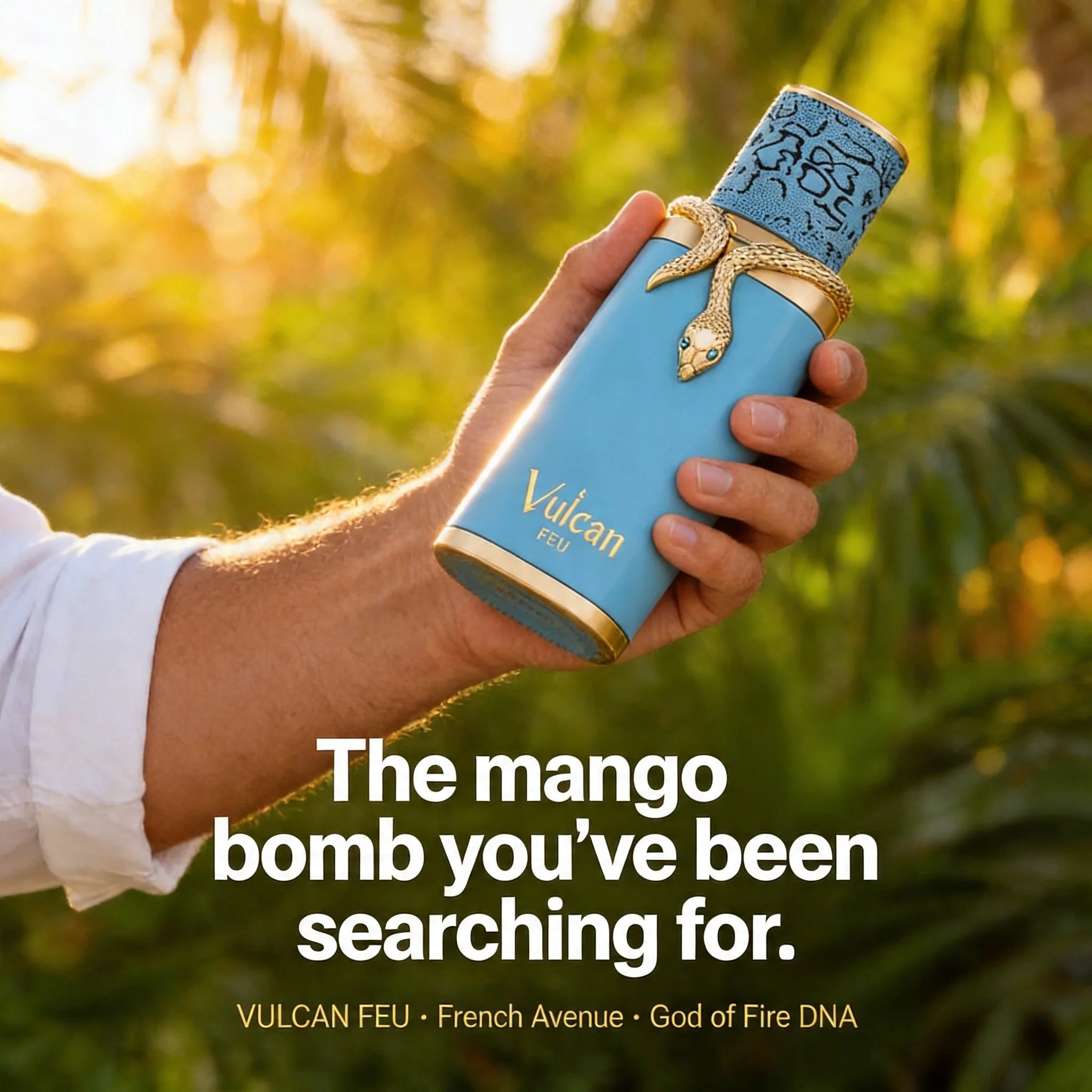 Hand holding a blue vape pen with gold accents against a blurred green background