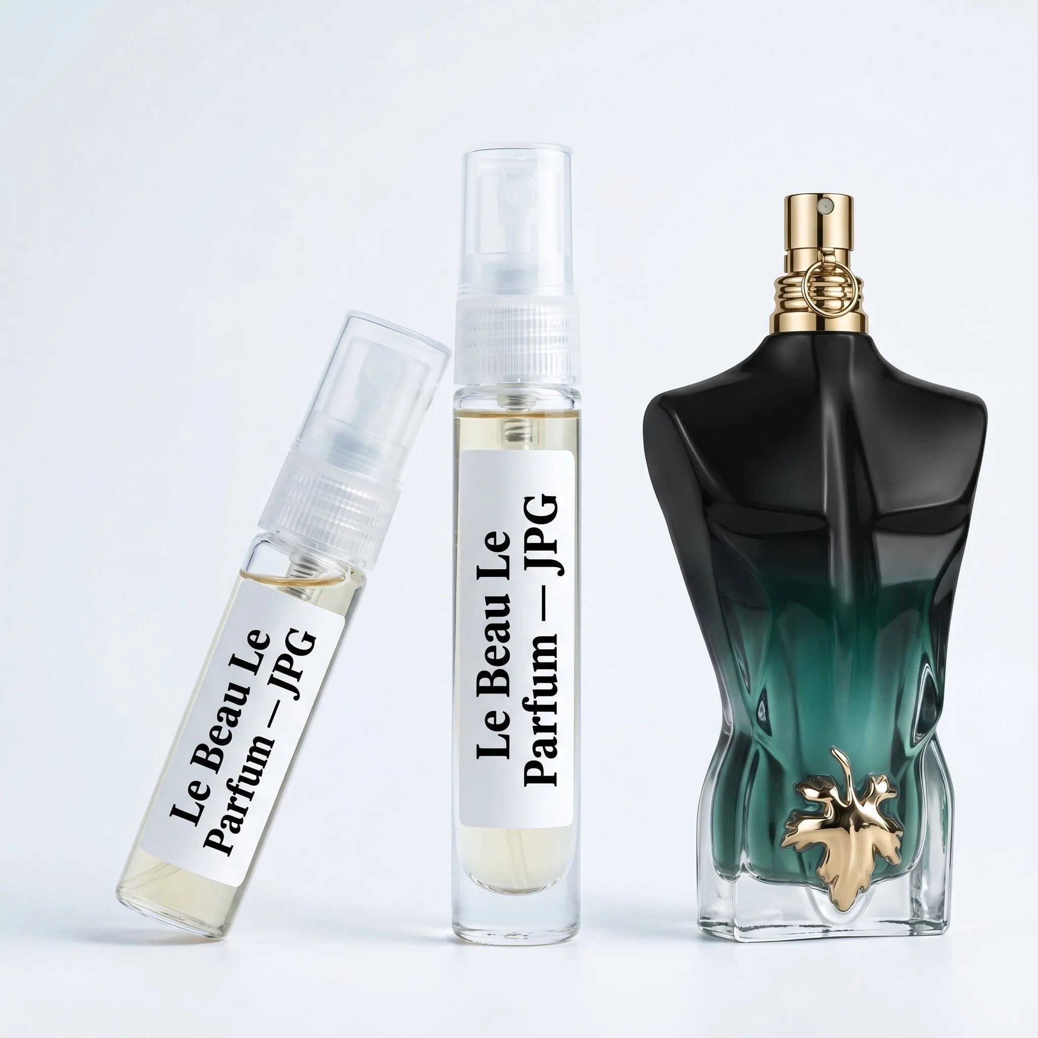 Jean Paul Gaultier Le Beau Le Parfum decant vials with black green gradient torso bottle on white background luxury fragrance photography