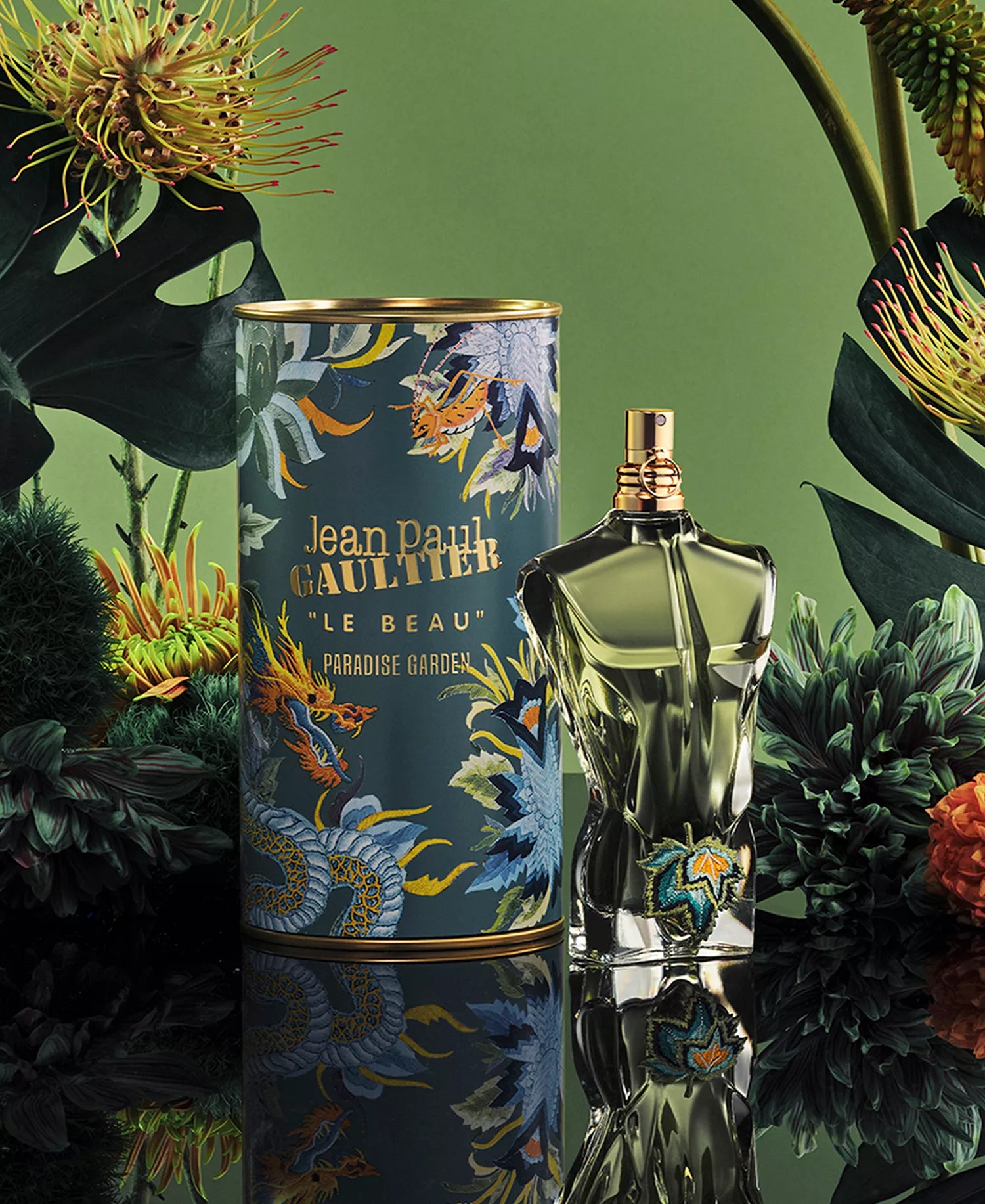 Jean Paul Gaultier Le Beau Paradise Garden EDP in green bottle with ornate botanical tin featuring tropical flower illustrations