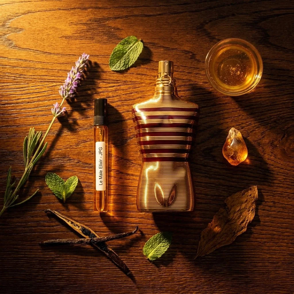 JPG Le Male Elixir bottle and decant on dark oak with lavender benzoin honey tonka bean and vanilla fragrance notes flatlay
