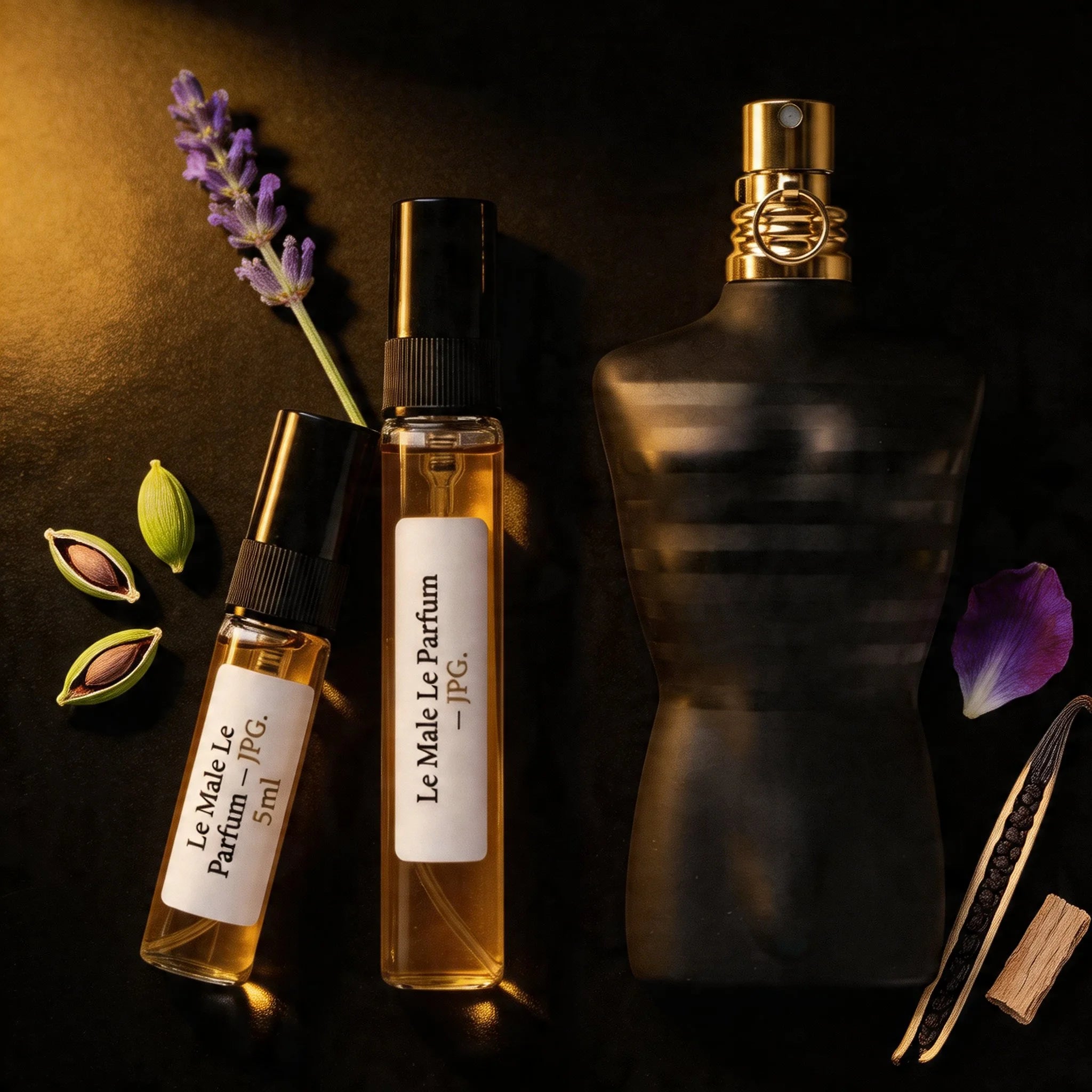 JPG Le Male Le Parfum bottle and decant on black lacquer with cardamom lavender iris and vanilla fragrance notes flatlay
