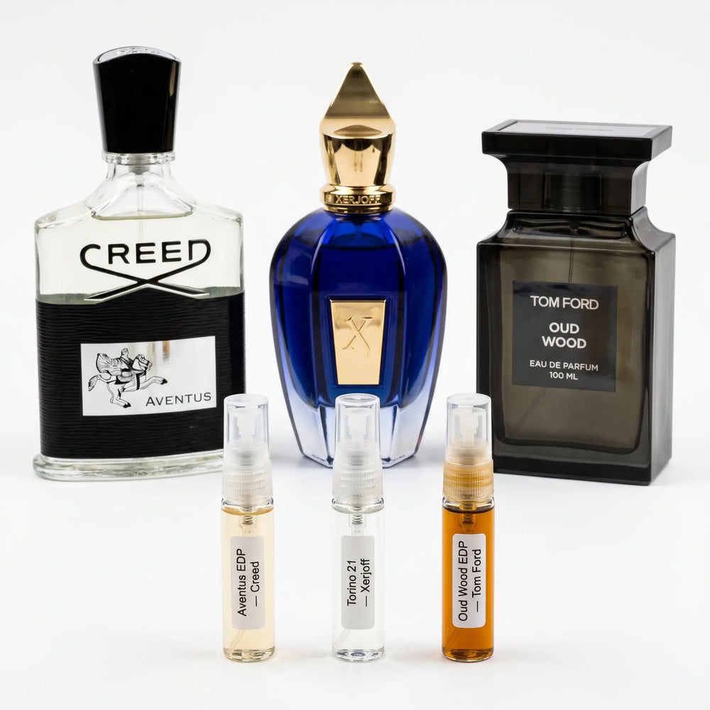 Legend Set hero — Creed Aventus, Xerjoff Torino21 and Tom Ford Oud Wood bottles with decants
