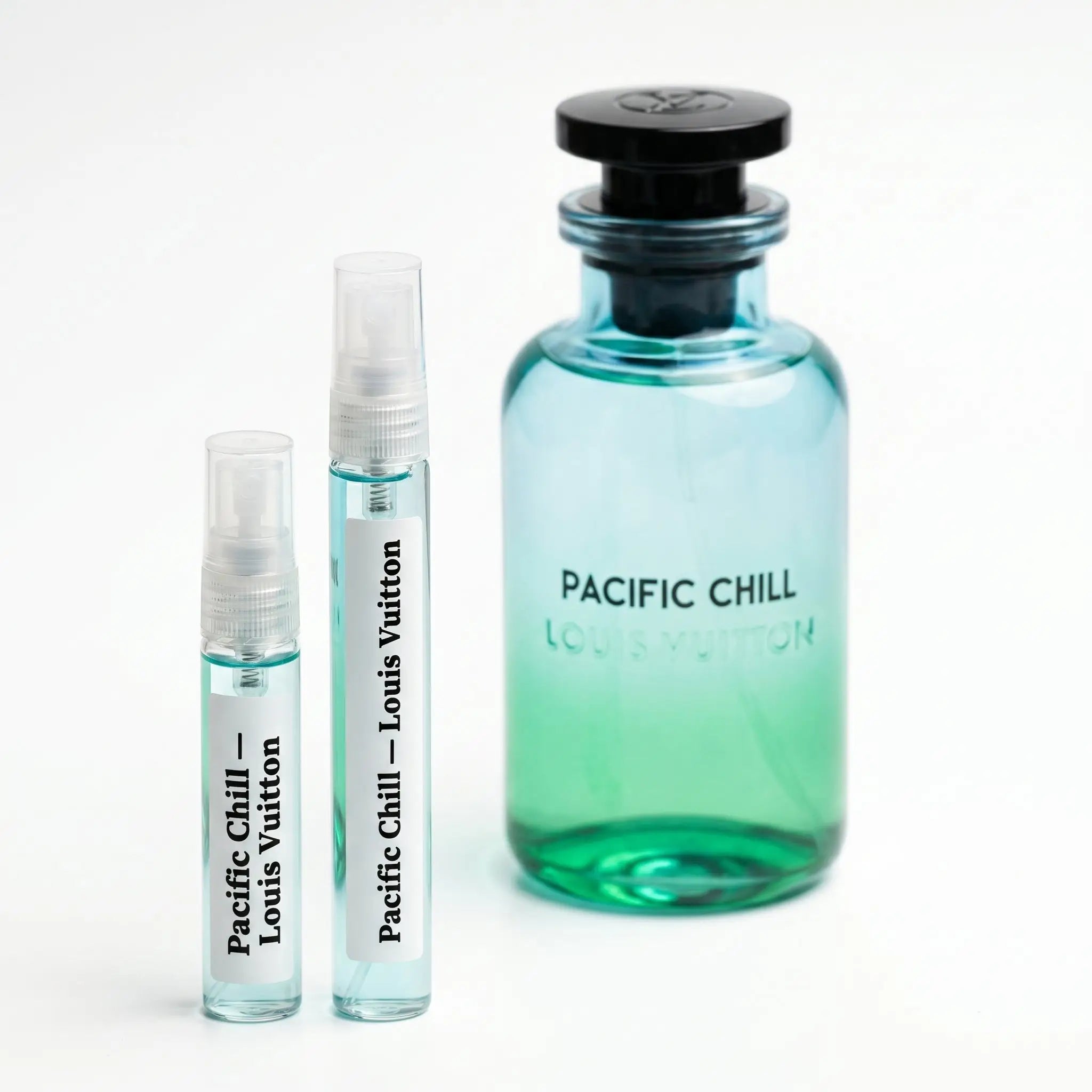 Louis Vuitton Pacific Chill 5ml and 10ml decant spray vials next to teal glass bottle