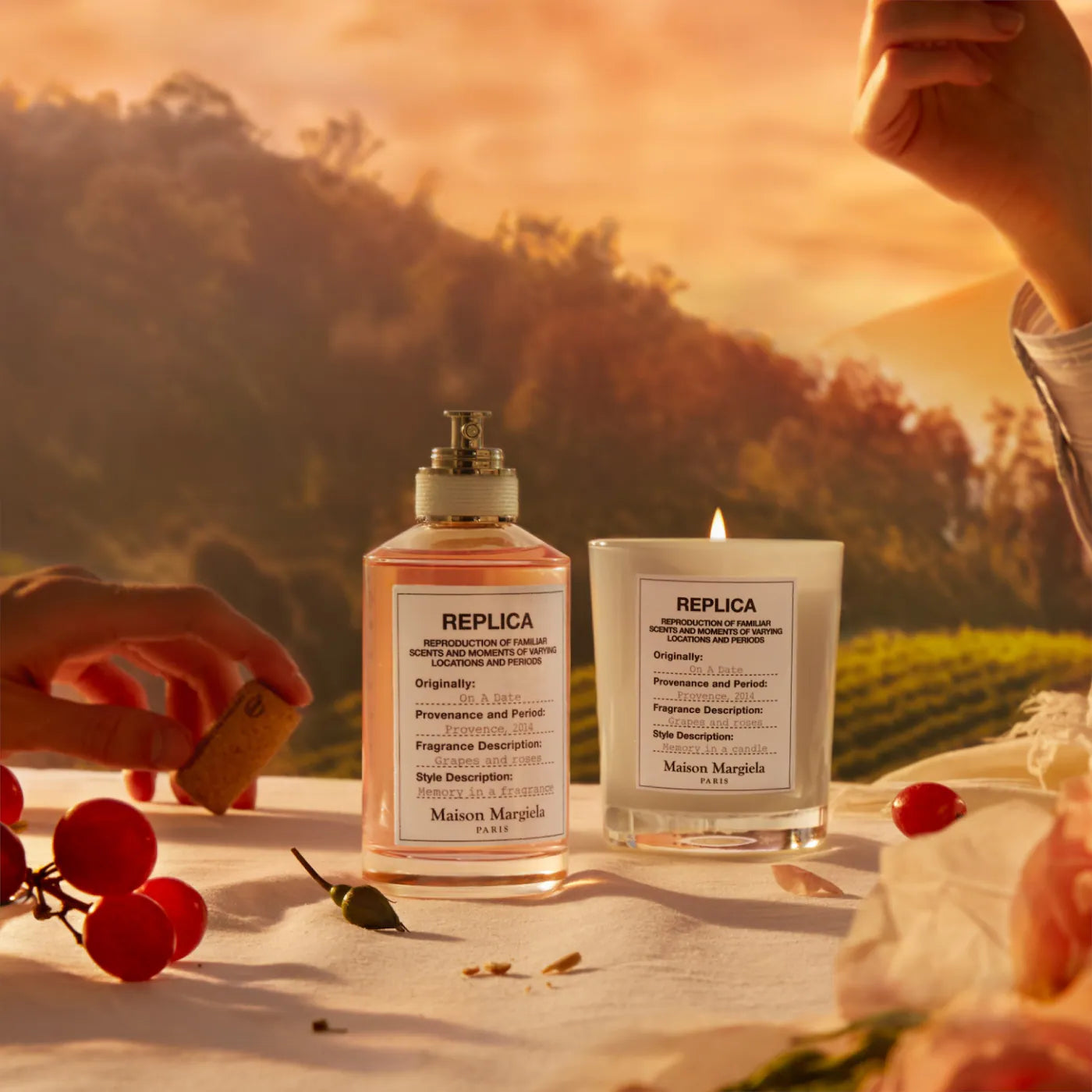 Two 'REPLICA' products on a table with a scenic background