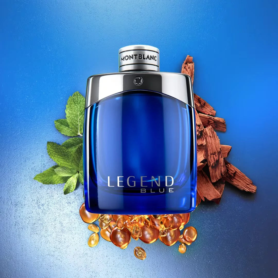 Montblanc Legend Blue perfume bottle with leaves and wood on a blue background