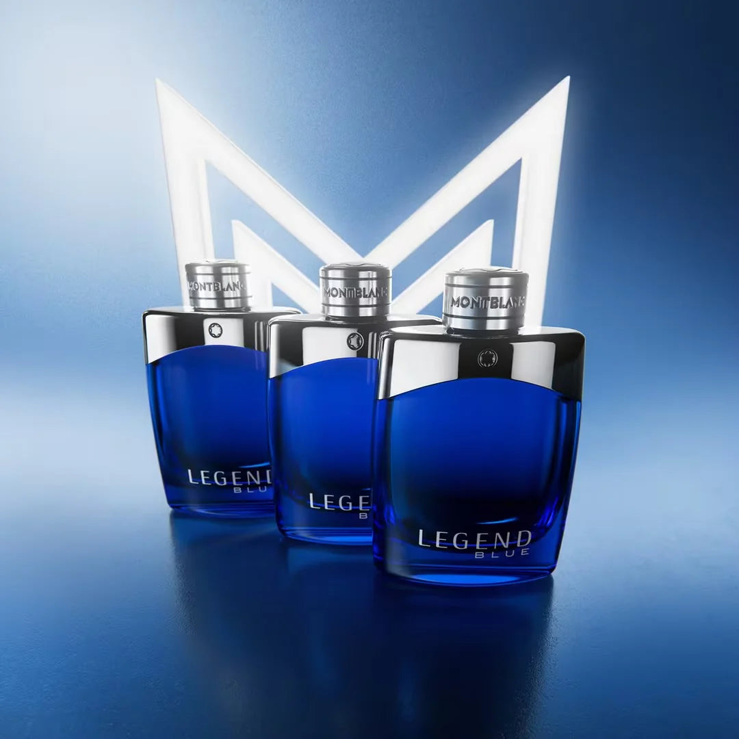 Three blue Montblanc Legend Blue perfume bottles on a gradient blue background