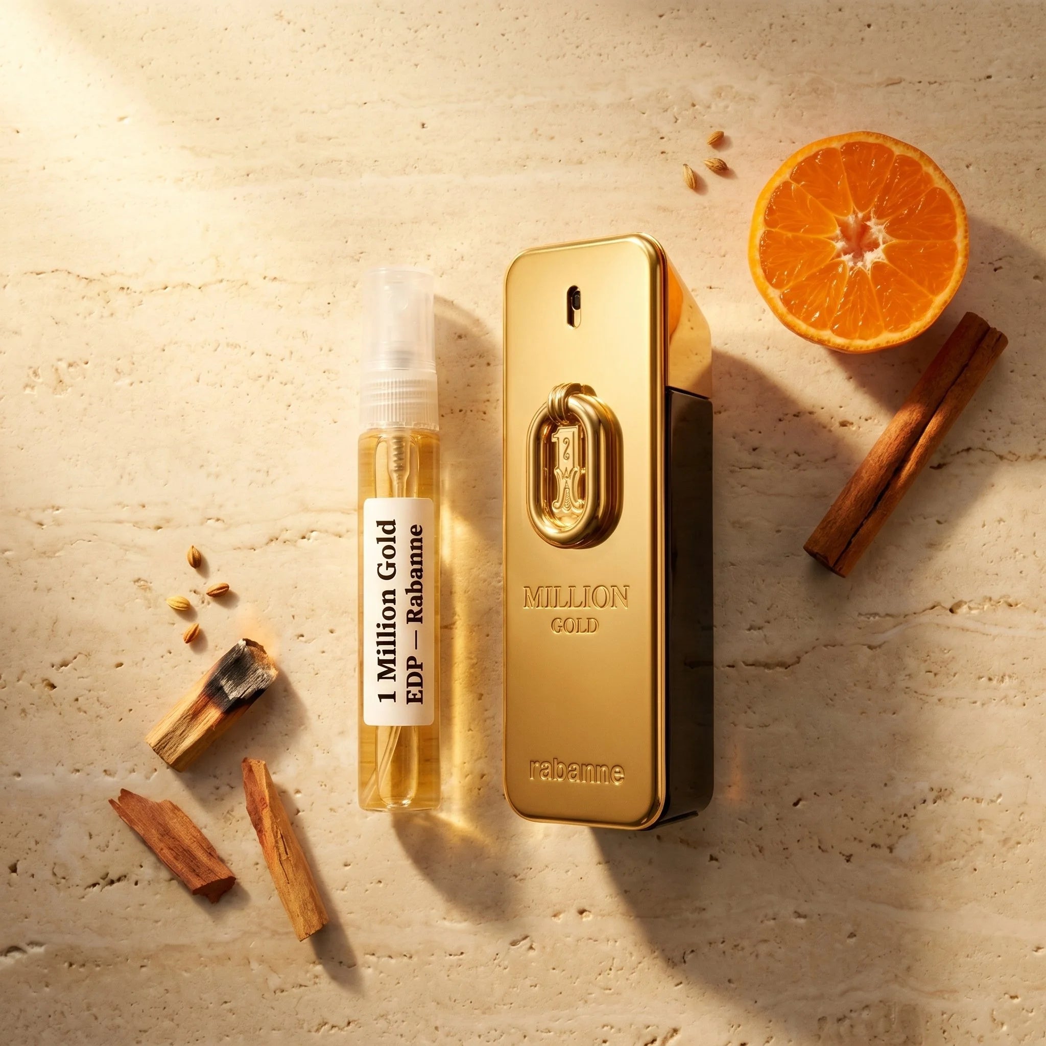 Rabanne 1 Million Gold EDP bottle and decant on travertine with mandarin orange sandalwood cedarwood fragrance notes flatlay