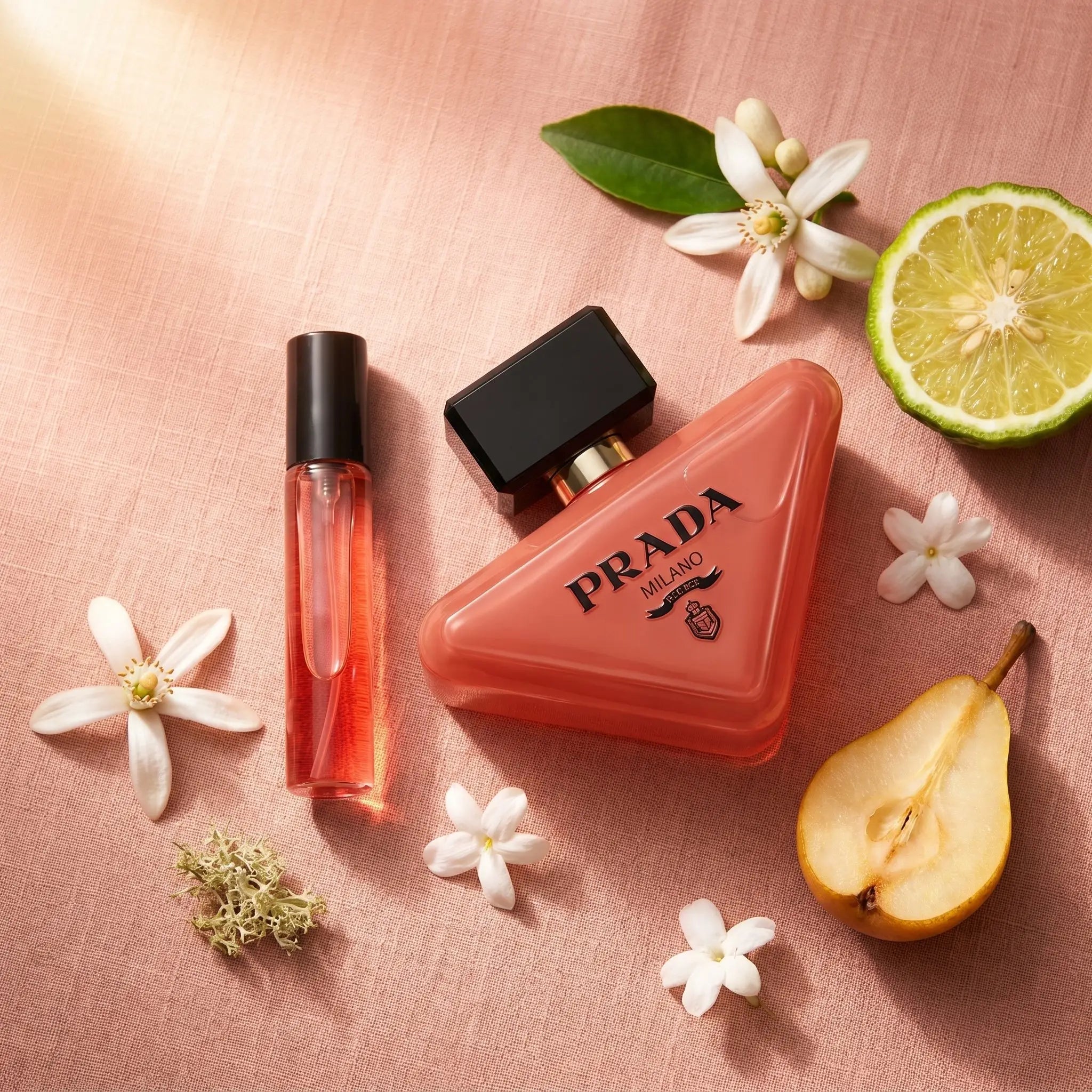 Prada Paradoxe Intense EDP decant on blush pink linen with neroli bergamot jasmine and pear fragrance notes flatlay