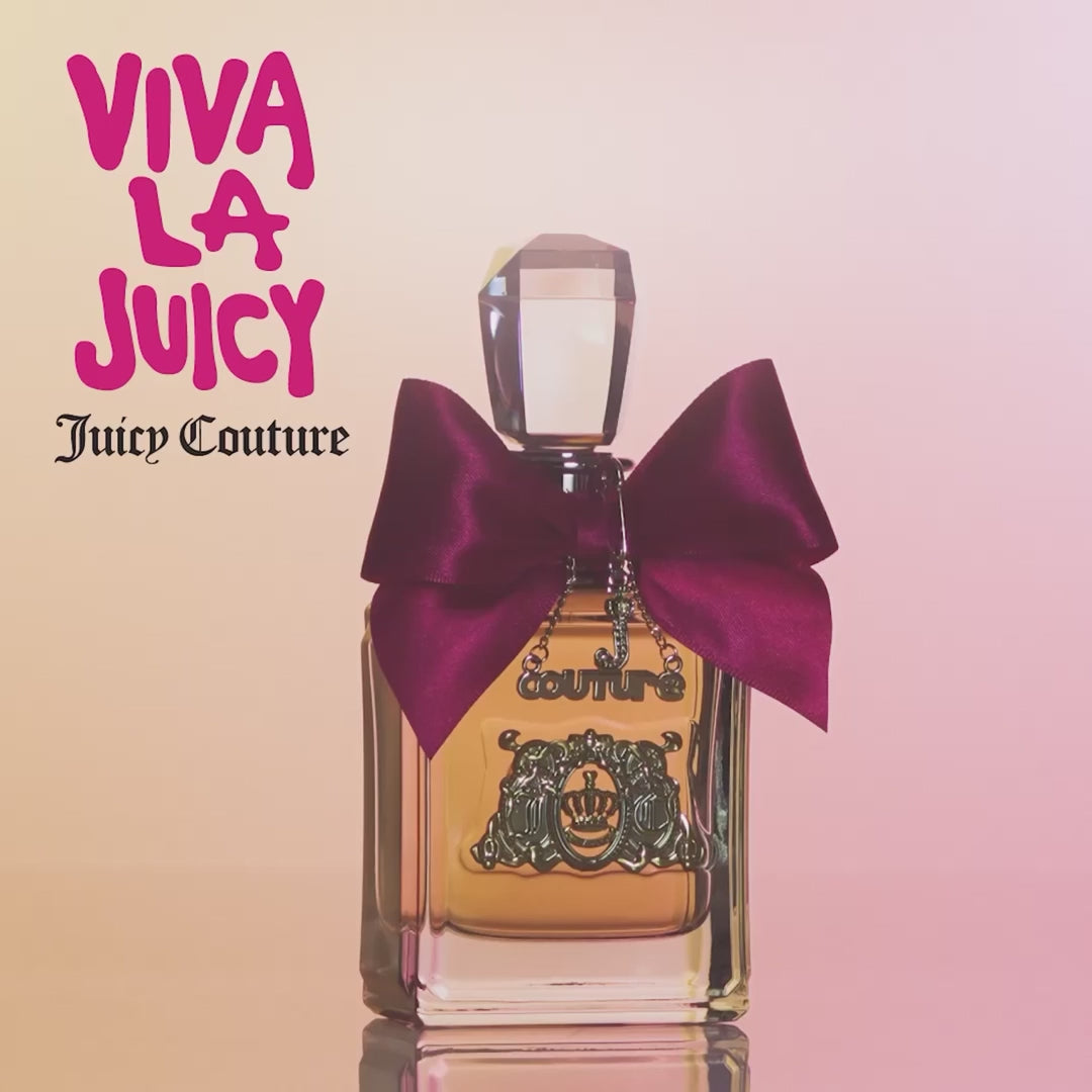 Juicy Couture Viva La Juicy - Aromatick perfume bottle with deep pink bow on a gradient pink background, perfect for health & beauty shoppers.