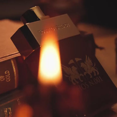 HOS N.001 EDP cologne by House of Sillage displayed near a flame, evoking warmth and richness of its woody amber scent.