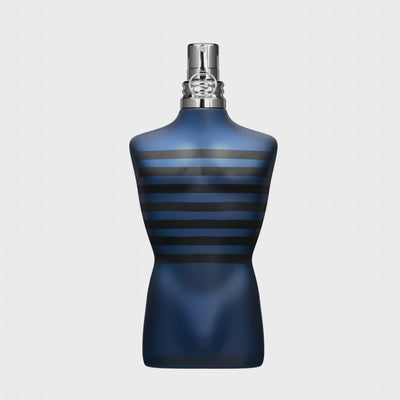 Close-up of Ultra Male EDT - Aromatick men's cologne bottle in dark blue with black stripes, shaped like a male torso.