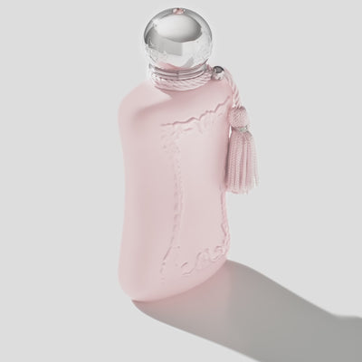 Delina La Rosée EDP by Parfums De Marly shown in a soft matte pink bottle with silver detailing, ideal for floral fragrance lovers.