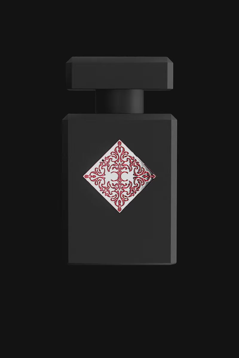 Initio Absolute Aphrodisiac EDP bottle in matte black with red baroque-style emblem, a sensual unisex fragrance from Initio Parfums Prives.