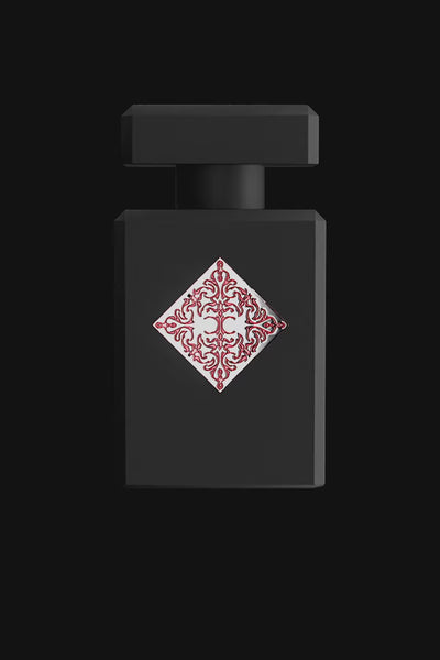 Initio Absolute Aphrodisiac EDP bottle in matte black with red baroque-style emblem, a sensual unisex fragrance from Initio Parfums Prives.