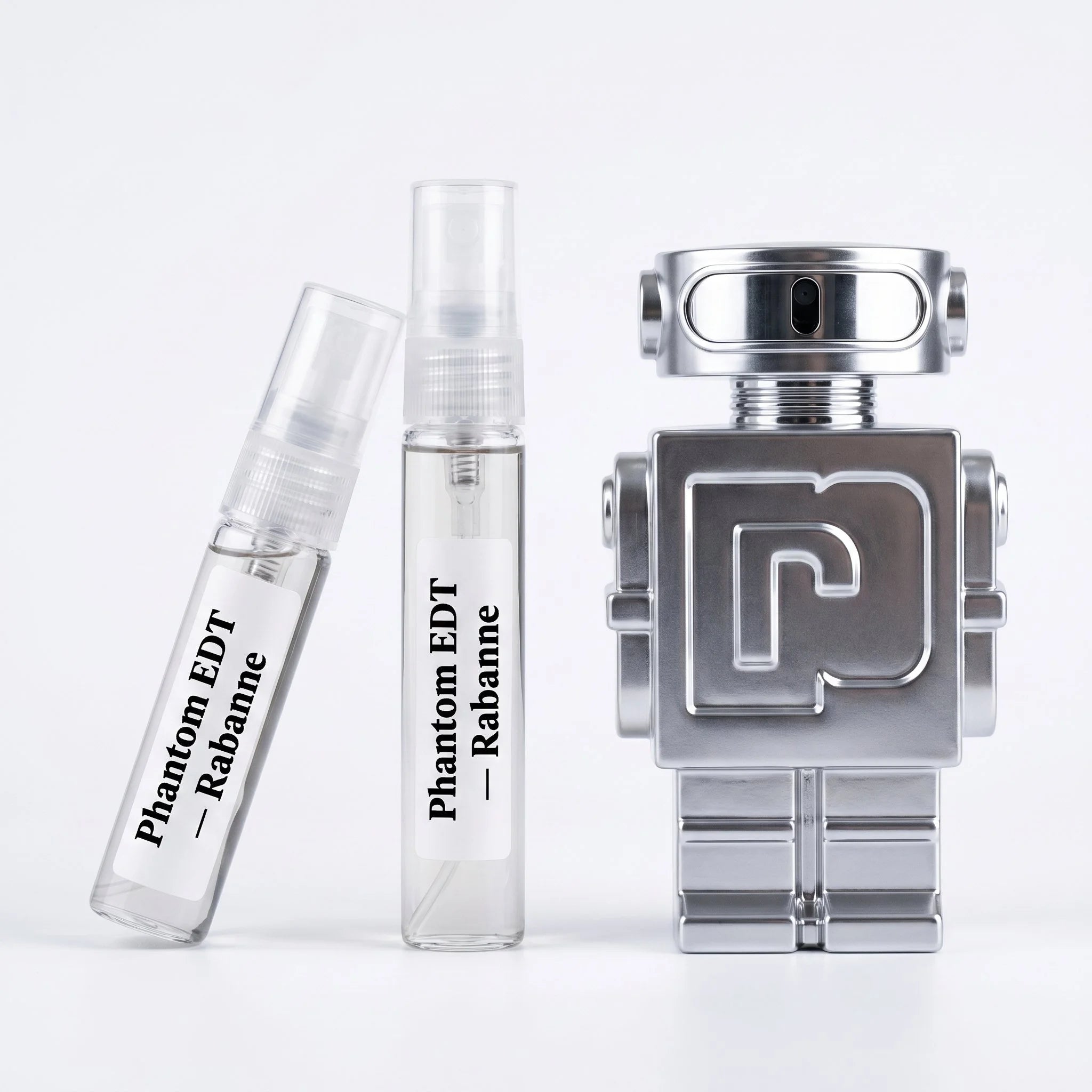 Rabanne Phantom EDT decant vials with silver chrome robot bottle on white background luxury fragrance photography