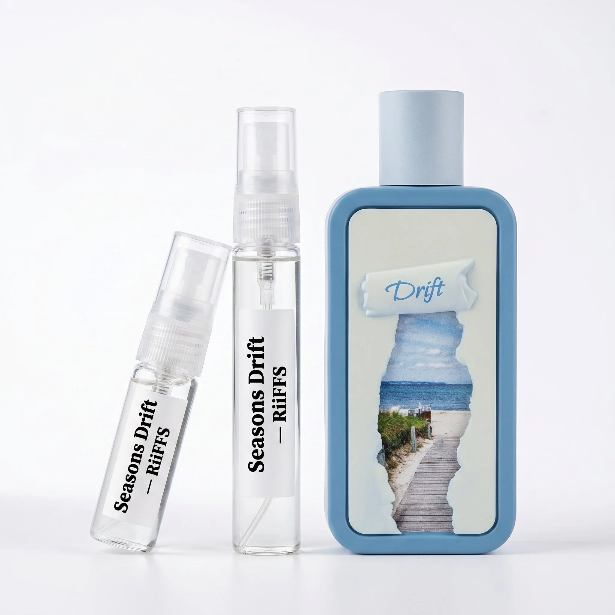 RiiFFS Seasons Drift decant spray set — 5ml and 10ml travel atomizers with 100ml bottle on white background

