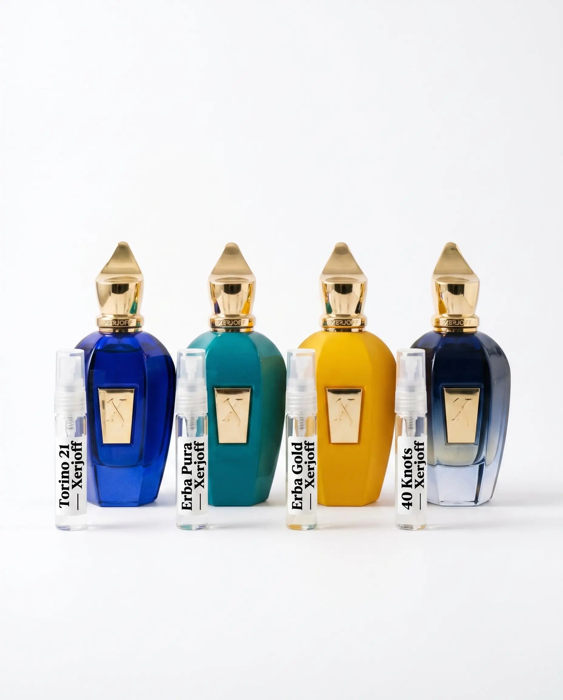 Xerjoff discovery set four bottles and decants — Torino 21 Erba Pura Erba Gold 40 Knots on white background