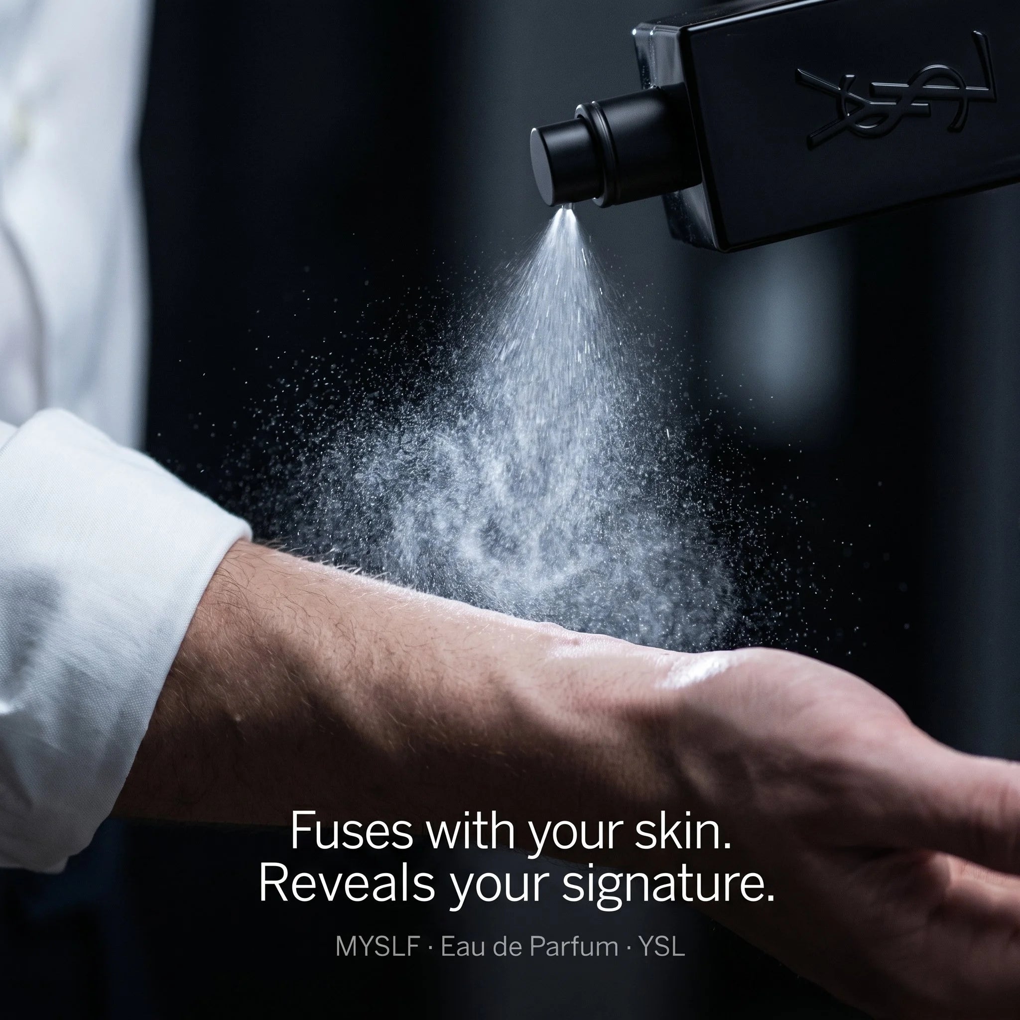 Person applying YSL perfume spray to arm with text 'Fuses with your skin. Reveals your signature.'